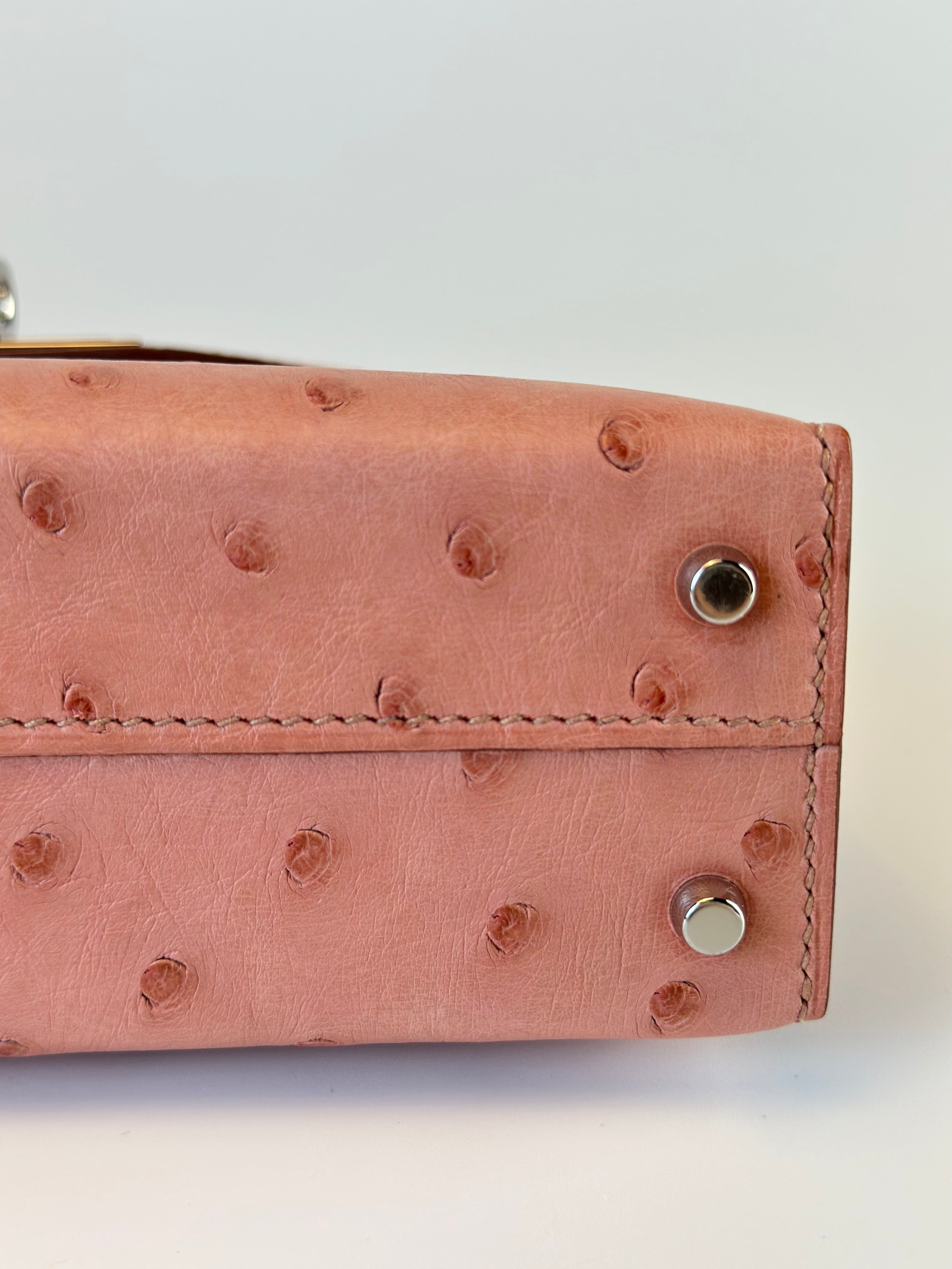 HERMES KELLY 20 OSTRICH SELLIER HANDBAG IN TERRE CUITE WITH PALLADIUM HARDWARE from below close up